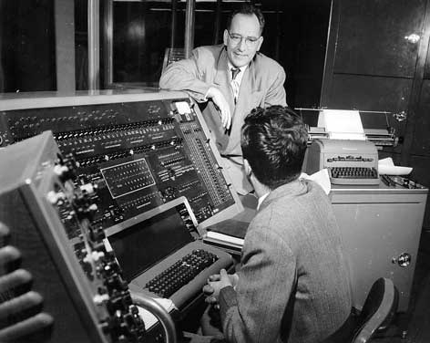 Mauchly leaning over UNIVAC console